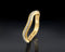 Gold ring with diamonds on a black background
