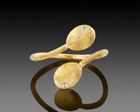 Abalone open bypass ring in yellow gold, each end finished in a brushed nugget with a diamond