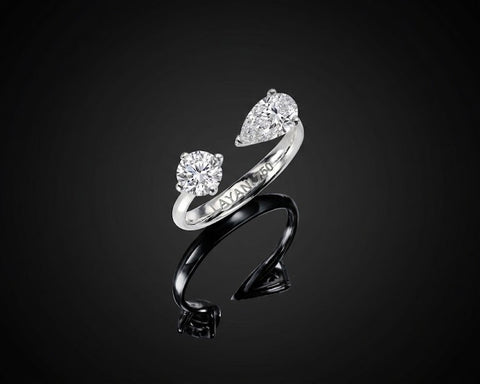 Aria open ring in white gold with round and pear shaped diamonds