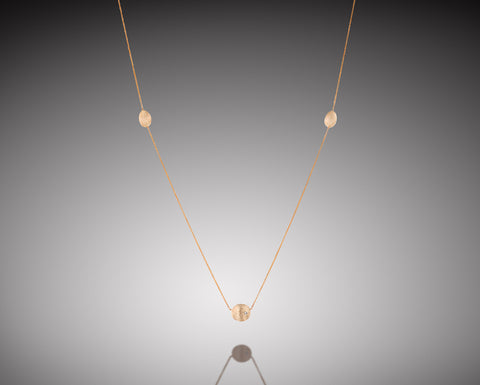Basket Star necklace in rose gold with three brushed nuggets and a diamond at the center