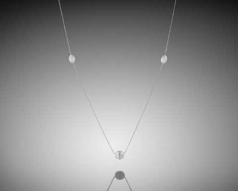 Basket Star necklace in white gold with three brushed nuggets and a diamond at the center