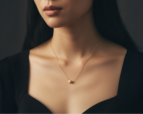 Bryozoa floating nugget necklace worn at the base of the neck