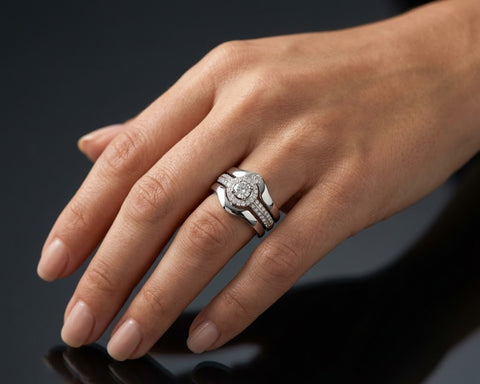 Eimy halo engagement ring and matching bands worn on the hand