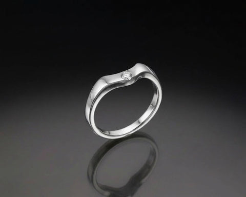 Profile of the Eimy engagement ring showing the french-set halo and pave shoulders