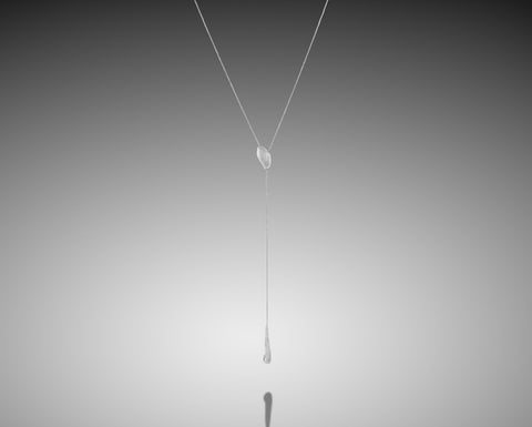 Flameback lariat necklace in rose gold with a diamond flame drop
