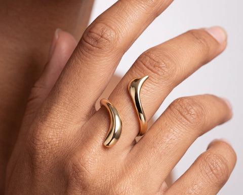 Dune open ring worn on the hand, showing the gap between the two ends
