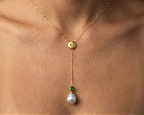Green Flame lariat necklace worn at the neck