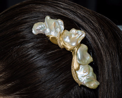 The Heaven brooch worn in the hair as a headpiece