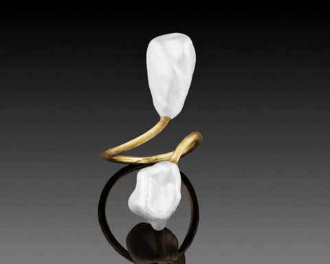 Hedva's ring as it began, an open twist band with two keshi pearls before the gold caps were added