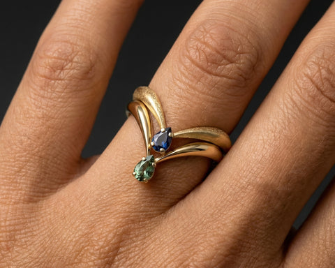 King Of Green V shape sapphire ring worn on the hand
