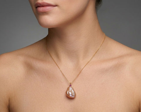 Lighthouse keshi pearl and ruby pendant worn at the neck