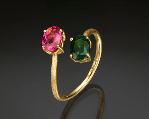 Majoris cocktail ring in yellow gold standing upright, showing the green tourmaline and rubellite from the side