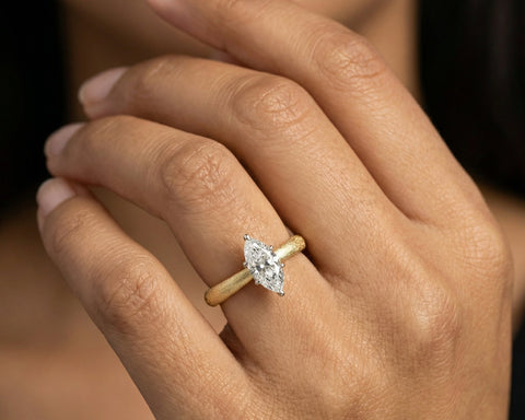 Nelli marquise diamond engagement ring worn on the hand