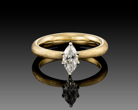 Nelli marquise solitaire engagement ring with a 0.44 carat diamond in brushed 18K yellow gold