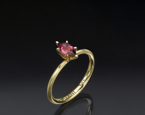 Side view of the Ortal ring showing the tapered band and low setting