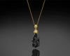 Video of the Ray Of Light pendant turning on its axis, showing the black tektite from every side