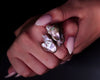Video of the 18K gold Duet ring worn on the hand, showing the purple overtones in the Keshi pearls