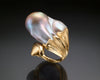 Video of a handmade 18K gold open ring with a 33 x 30 mm baroque Keshi pearl, turning to show the pearl's lustre