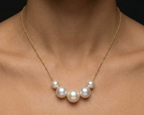Quintuple cocktail pearl necklace worn at the neck