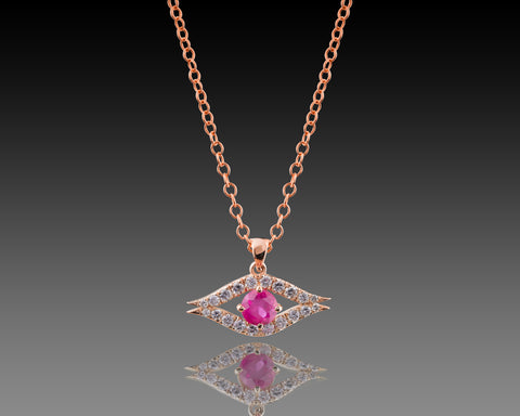 Rose gold guardian eye pendant with a ruby center stone