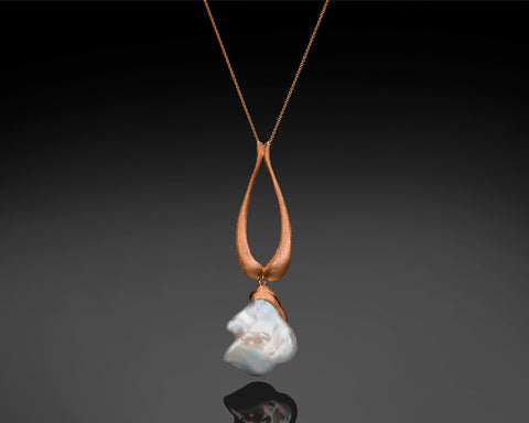 Handmade 14K rose gold teardrop pendant with a large white baroque pearl