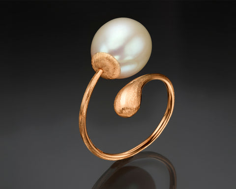 Second angle of a rose gold twist ring with a white drop pearl