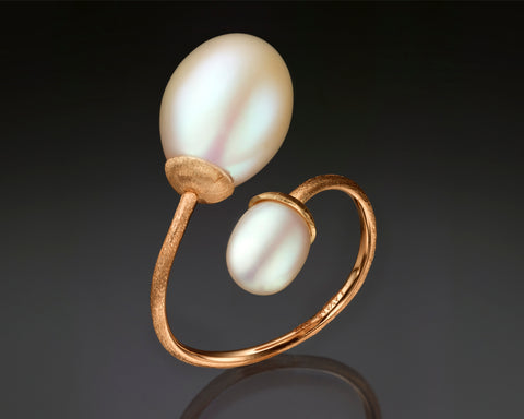 Second angle of a rose gold open ring with two white drop pearls