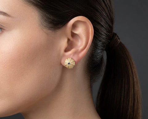Sea Urchin stud earring worn on the ear