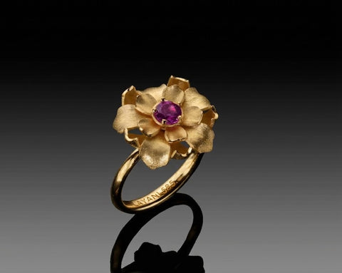 Shani blooming flower ring with a 0.60 carat natural ruby in 18K yellow gold