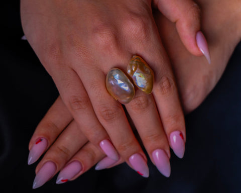 The Sky open ring worn on the hand, showing the two Keshi pearls at either end of the band