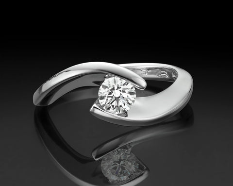Suspended Light tension ring with a 0.50 carat diamond held between two wrapping arms in 18K white gold