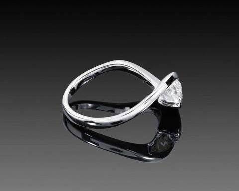 Three quarter view of the Suspended Light ring in 18K white gold