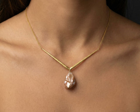 Vega Keshi pearl necklace worn at the neck