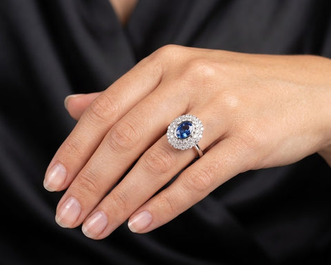 Vered sapphire halo ring worn on the hand