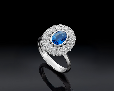 Vered heart sapphire halo ring with a 0.85 carat oval blue sapphire in 18K white gold