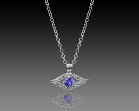 White gold guardian eye pendant with a blue sapphire center stone