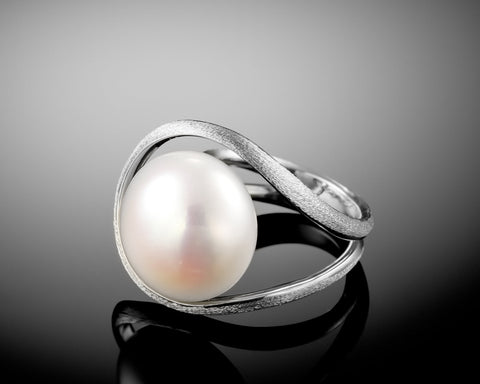 Handmade 18K white gold ring with a white bouton pearl floating in an open circle