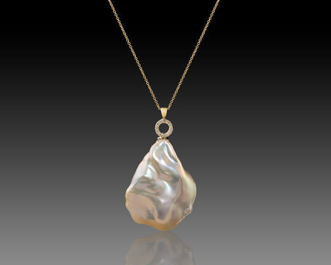 Handmade 14K yellow gold necklace with a very large white Keshi baroque pearl and a diamond set circle
