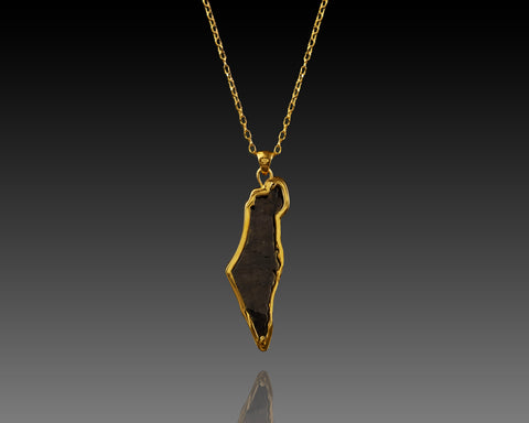 Sapphire hand cut into the outline of the Land of Israel, set in gold on a fine chain