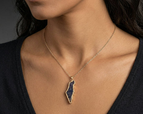 Land of Israel sapphire pendant worn at the neckline