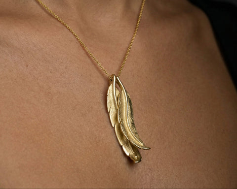 Wild Condor feather necklace worn at the neckline