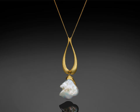 Handmade 14K yellow gold teardrop pendant with a large removable white baroque pearl