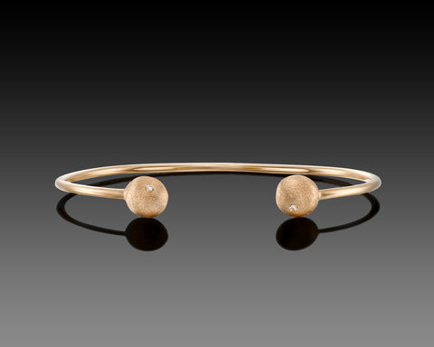 Yellowtail open bangle in rose gold with a diamond nugget at each end