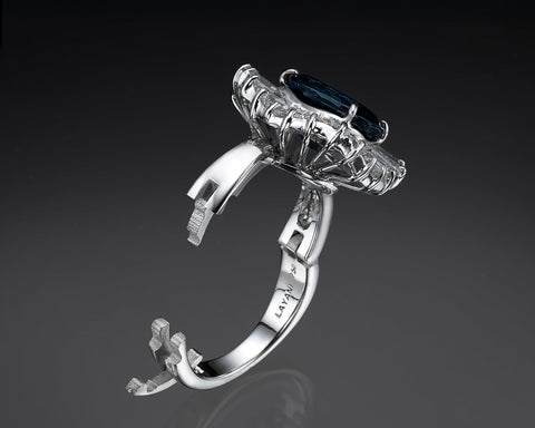 The same ring opened, showing the three-part lock built into the shank