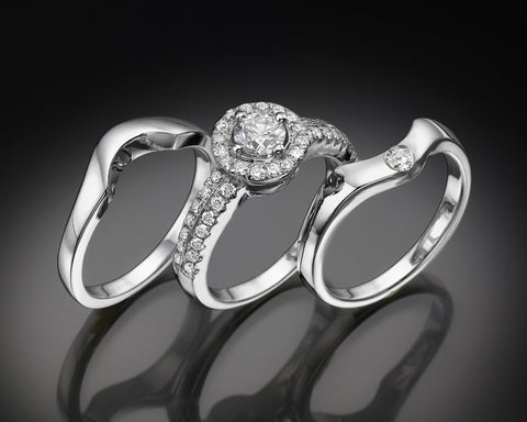 Side view of the Eimy engagement ring stacked between its two matching bands