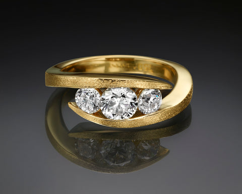 Liliane three-stone ring with 1.31 CT of diamonds wrapped in 18K yellow gold