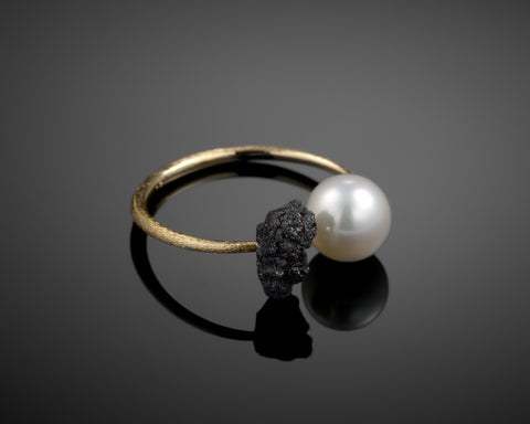 Corona ring, raw black diamond set around an open 18K yellow gold band beside an 8mm freshwater pearl, by LAYANI Fine Jewelry Jerusalem