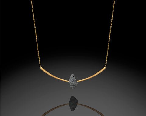 Crescent necklace, 3.50 carat raw black diamond set into a brushed 14K yellow gold arc, by LAYANI Fine Jewelry Jerusalem